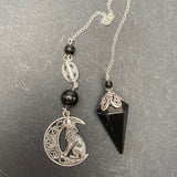 Shungite Pendulum with Howling Wolf on Celtic Moon